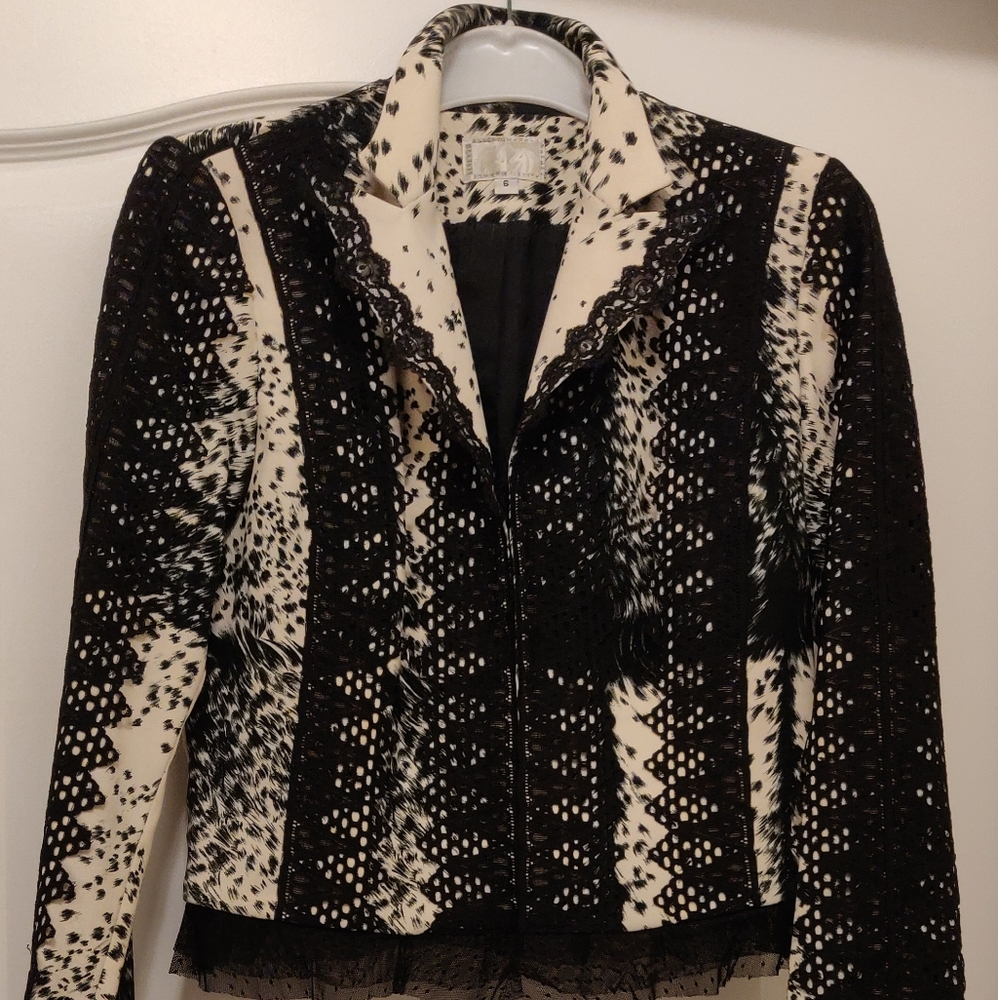 Fashion black and white jacket with lace trim.